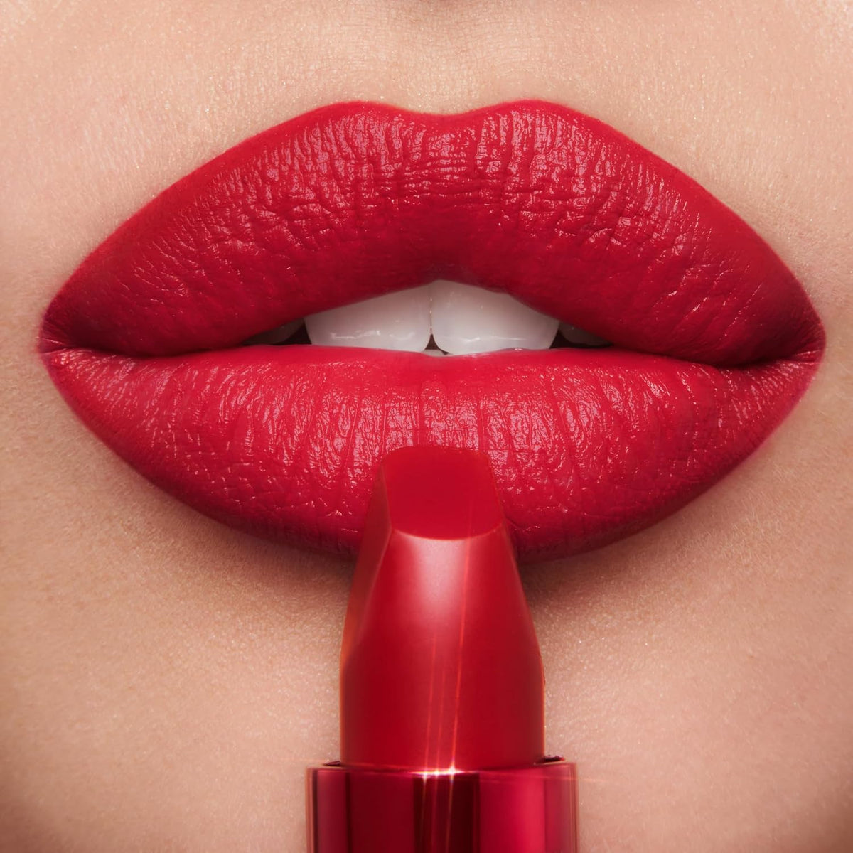 Hydrating matte lipstick by Charlotte Tilbury in a vibrant red red-carpet shade.
