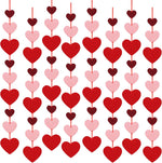Auihiay Valentines felt heart hanging string garlands front view showing pre assembled red pink and burgundy hearts hanging vertically against a wall backdrop