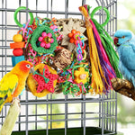 Close up of YIXUND budgie shredder toy displaying non toxic paper and corn husk textures.