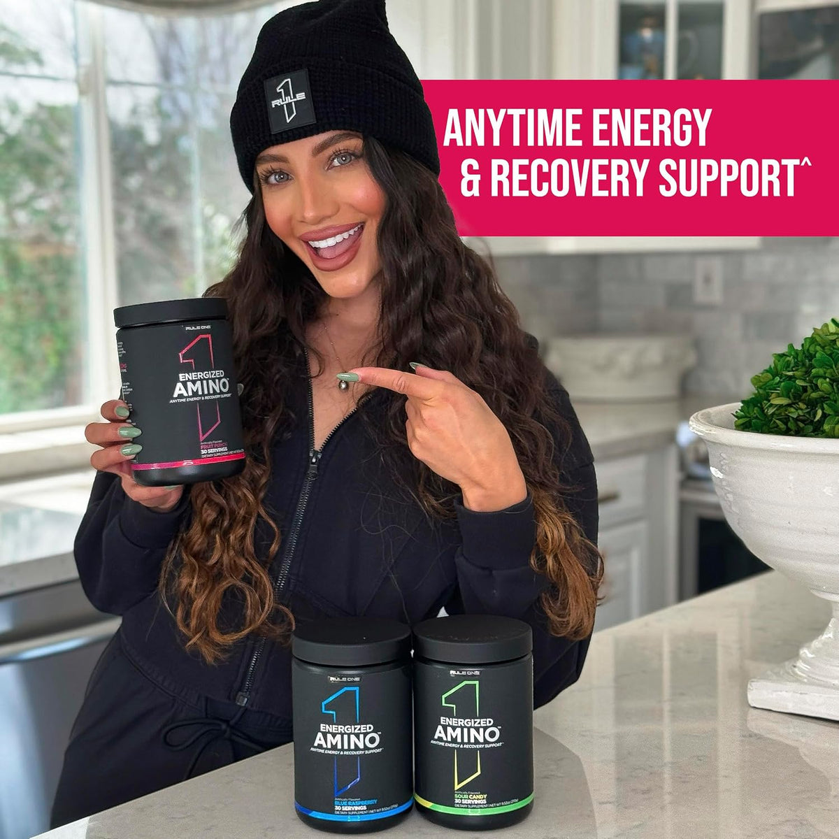 Athlete mixing Rule 1 Energized Amino with cold water in a shaker