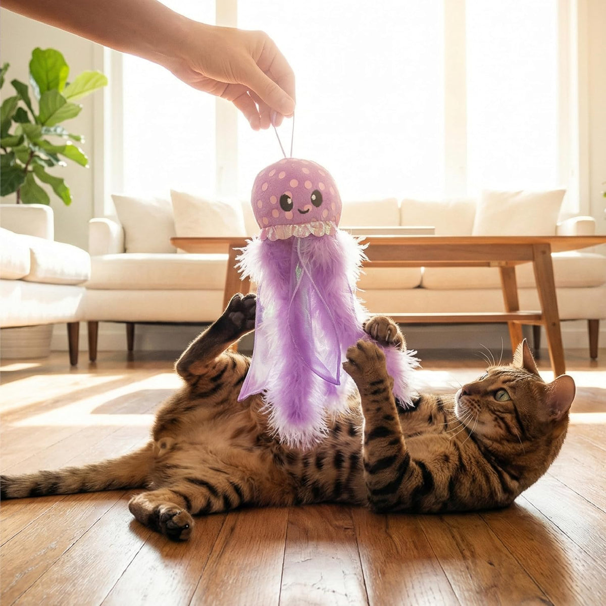 Catstages octopus toy featuring feathers and ribbons
