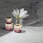 Side view of Estee Lauder Resilience Eye Cream jar with gold cap