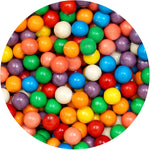 The Hampton Popcorn Company Gumball Machine Refills pouring colorful candy into a small tabletop dispenser globe