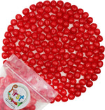 Soft and tangy round chewy candy balls in green red yellow purple
