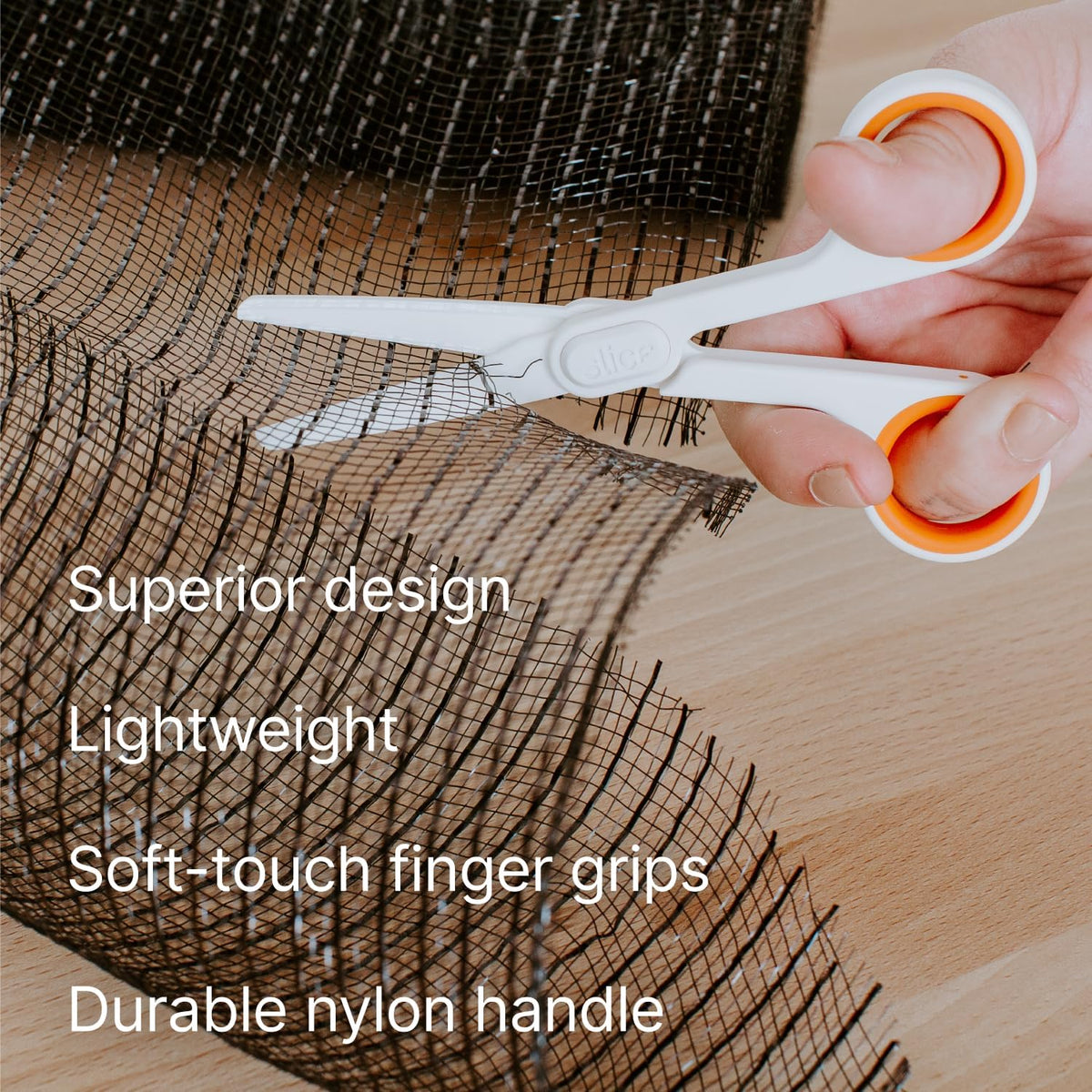 Slice ceramic scissors held in hand demonstrating ergonomic grip
