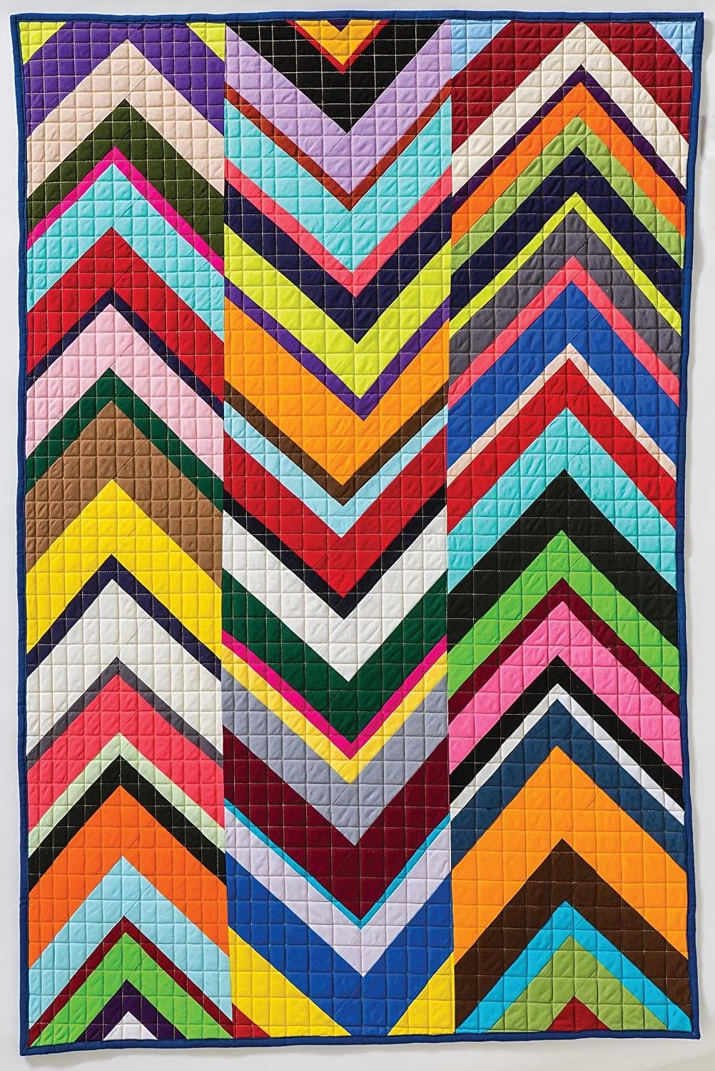 Open pages displaying interior quilting techniques and color photographs