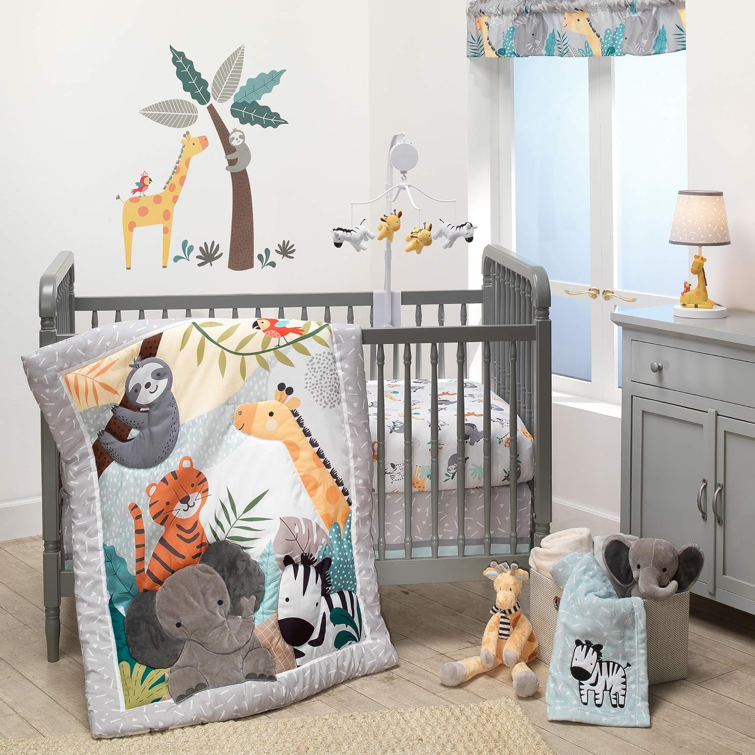 Bedtime Originals Mighty Jungle 3 piece crib bedding set front view showcasing the quilt and matching sheet