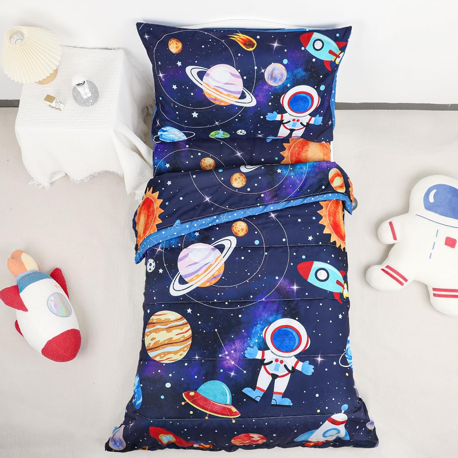 SWESEN blue space toddler bedding set front view showcasing the astronaut and rocket comforter design