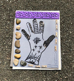 Craftsman applying cyanotype sensitizer liquid onto artist paper with brush