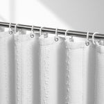 Lameirose white fabric shower curtain front view showing tufted stripe textures in a modern farmhouse bathroom setup.