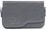 MegaGear camera case angled view showing strap attachment