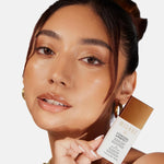 Milani face makeup bronzing drops formula blended on skin