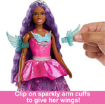 Close up of Barbie Brooklyn doll star pattern dress and wing arm cuffs
