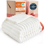 Bedsure GentleSoft white throw blanket folded on a modern couch