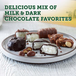 Premium imported chocolate gift box surrounded by elegant Mother's Day themed decorations.