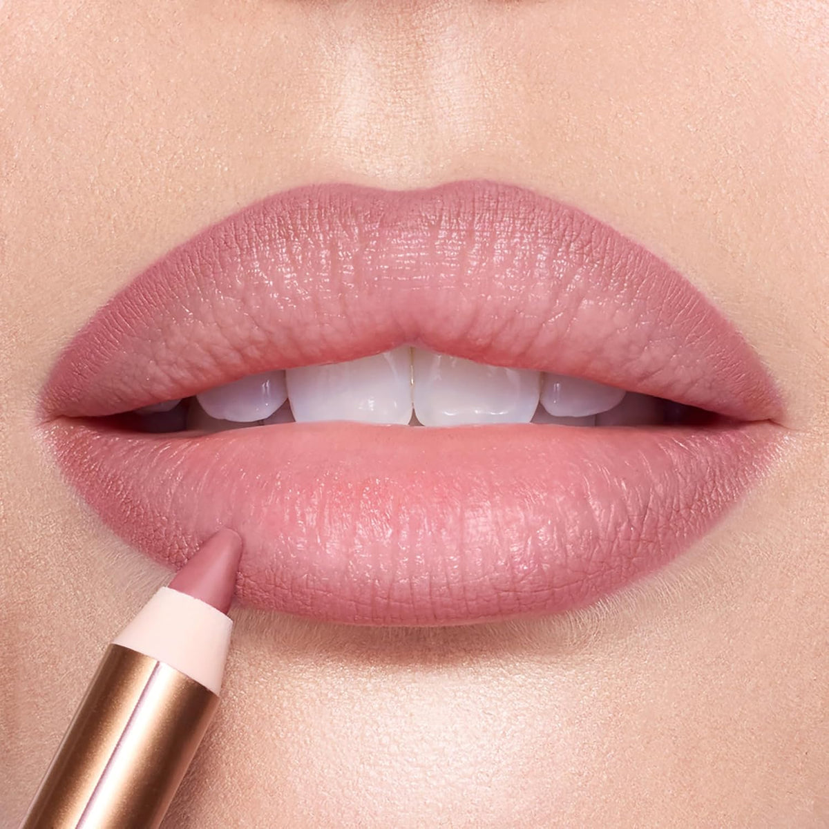 Close up of Charlotte Tilbury Pillow Talk Fair lip liner showcasing the fine tip for precise lip defining.
