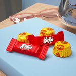 Assorted miniature chocolate wafer bars and peanut butter cups spread out