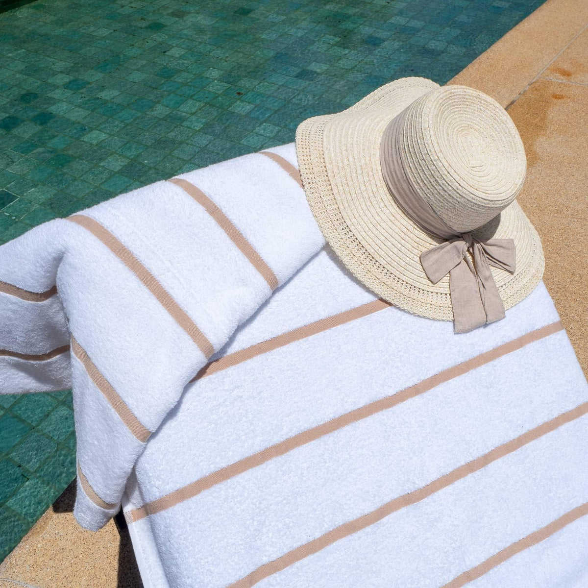 Arkwright beach towel cover draped over an outdoor lounge chair.