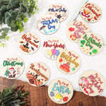 FYSUIMU baby milestone cards front view of wooden holiday discs for photography.
