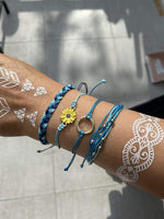 Long Tiantian boho braided wave bracelets stacked on wrist
