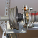 Set screws and cable slot close up on torsion spring drum