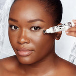 Charlotte Tilbury eye serum being applied to under eye area