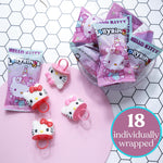 Individually wrapped strawberry and fruit punch flavored wearable candy rings displayed outside the box
