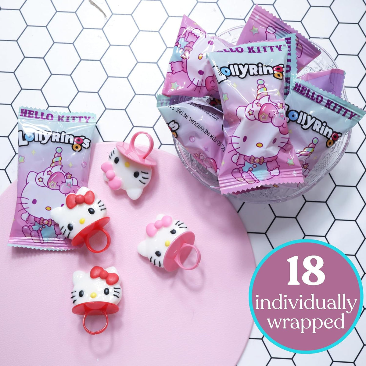 Individually wrapped strawberry and fruit punch flavored wearable candy rings displayed outside the box