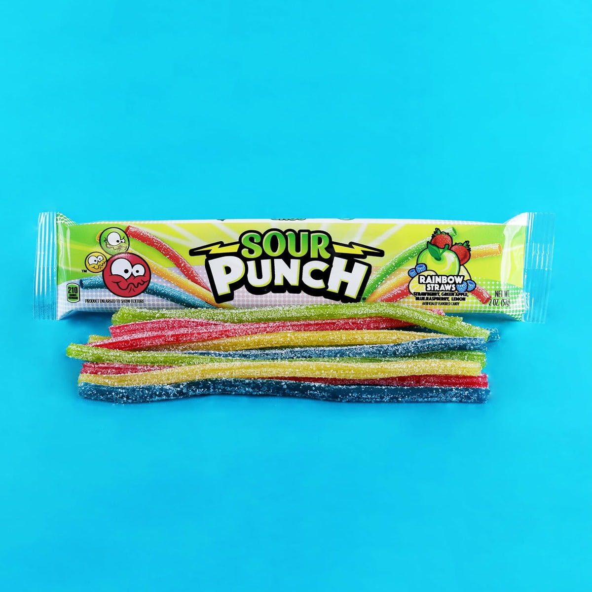 Close-up of sugar-coated rainbow chewy straws in strawberry and green apple.
