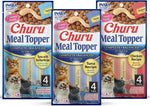 Hand feeding a cat with Inaba Churu Meal Topper tube
