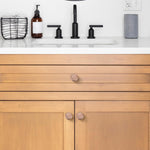 Round single hole dresser knob angled view