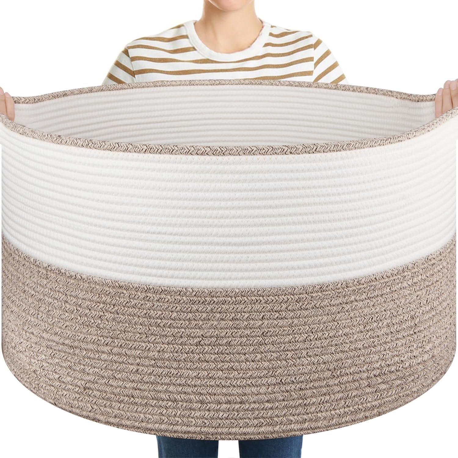 OIASKET Large Cotton Rope Storage Basket front view holding blankets in a modern living room.