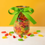 Close up view of assorted cherry, lemon, lime, orange, and strawberry chewy candies out of the packaging.