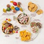Festive nutcracker theme holiday hamper tins placed under a decorated Christmas tree