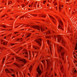 Long red candy straws showing detail of the chewy texture and vibrant strawberry color.
