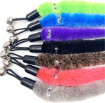 Close up view of fuzzy caterpillar wand attachment with bell