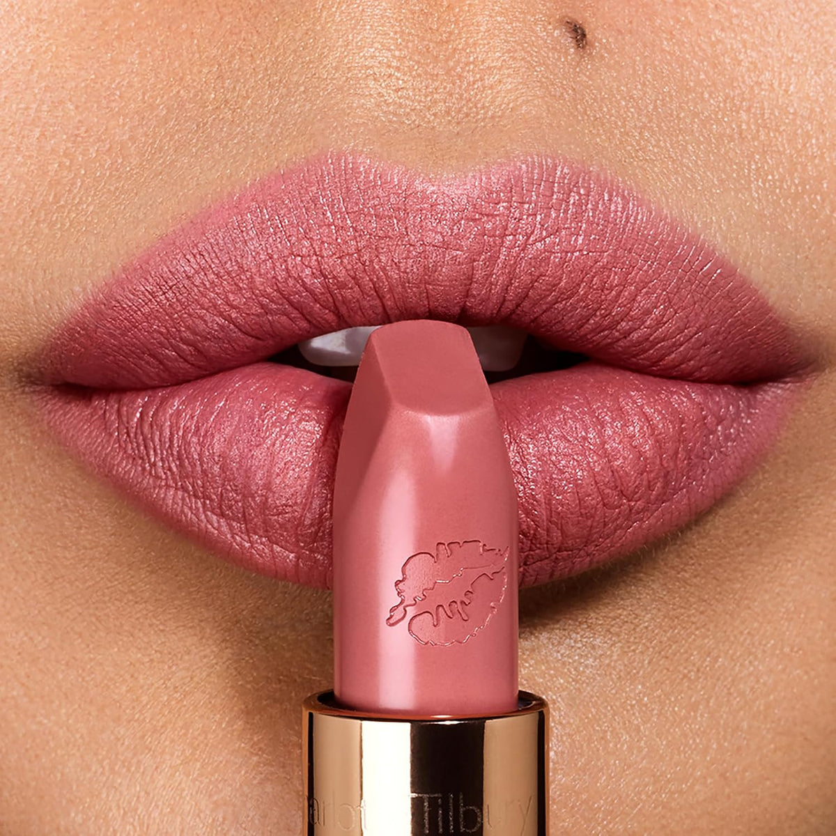 Close up of Charlotte Tilbury Hot Lips lipstick bullet with kiss logo