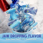 Ocean themed candy buffet decorations featuring shark lollipops