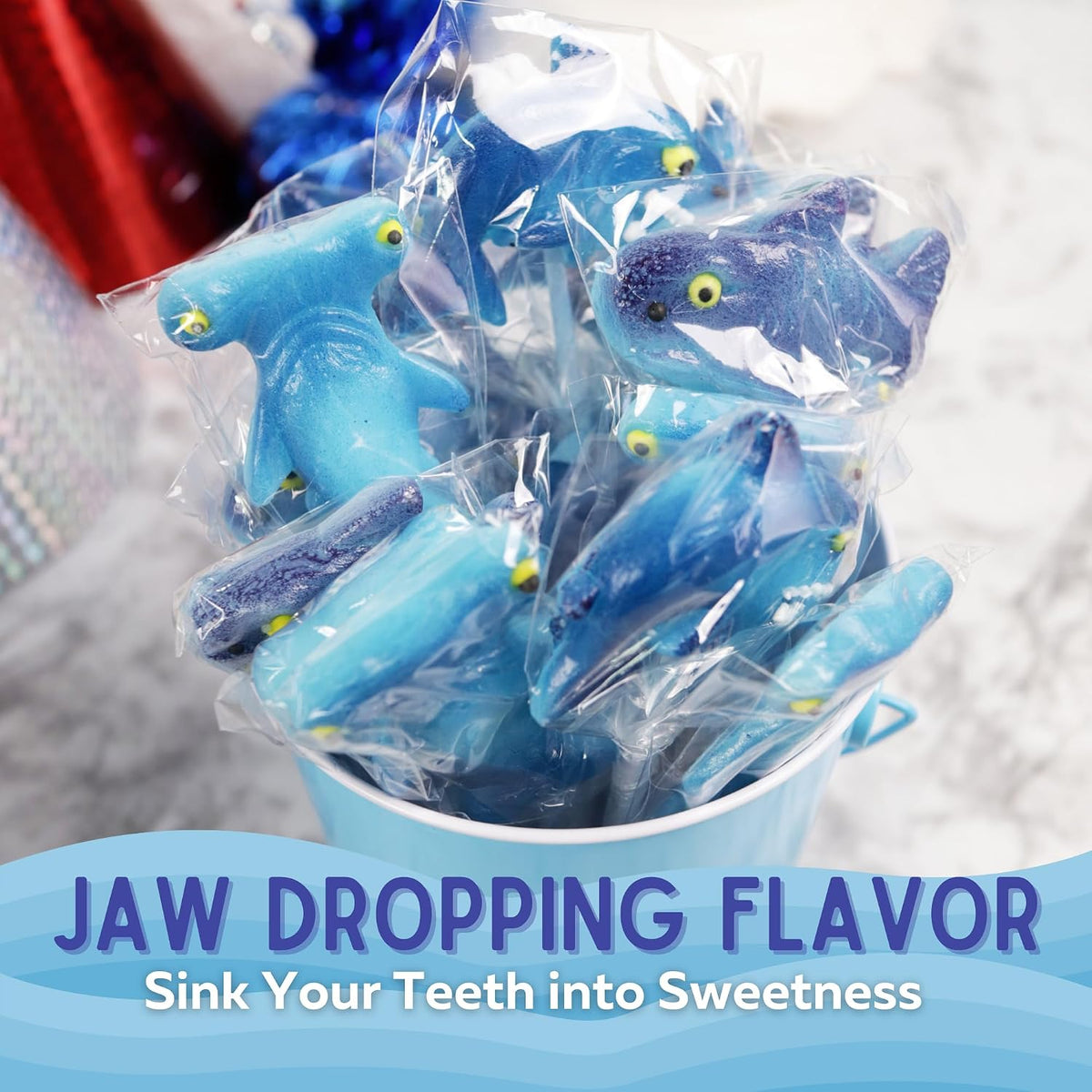 Ocean themed candy buffet decorations featuring shark lollipops
