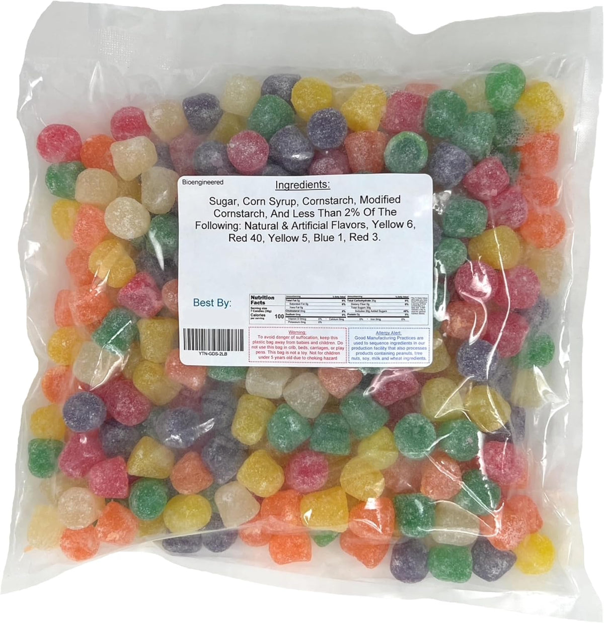Assorted cinnamon clove and anise flavored chewy gumdrops piled in a decorative glass candy dish.