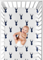 Standard crib mattress styled with forest animal theme sheet