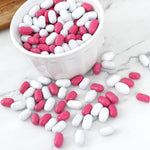 Classic American pink and white pill shaped licorice candies on display for party buffets.