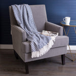 DII throw blanket draped over living room sofa