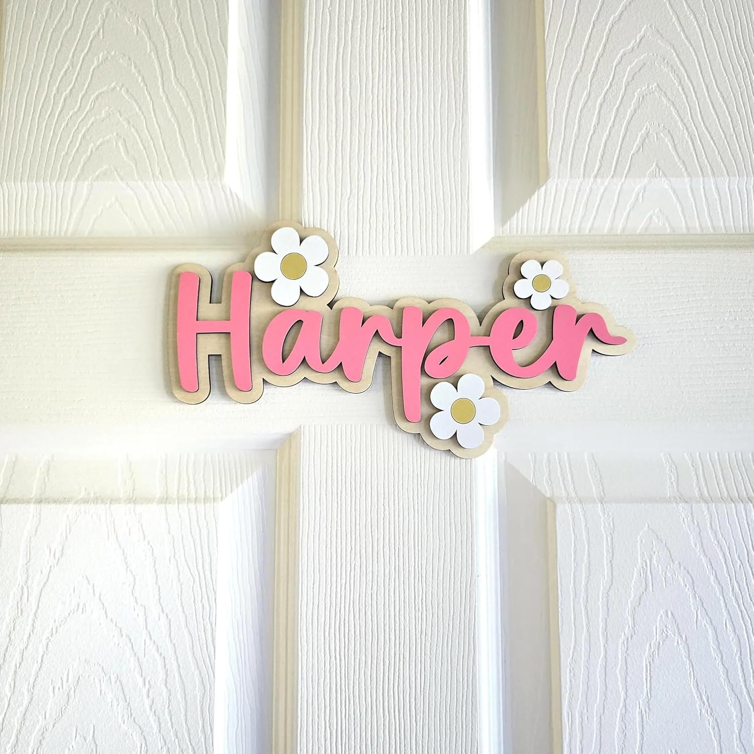 LinCognivant daisy personalized wooden nursery name sign front view showing customized floral lettering.
