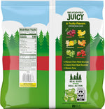 Black Forest Gummy Bears candy assorted fruit flavors spread out on a table.