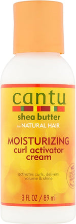 Cantu pack of four curl activator cream bottles arranged together