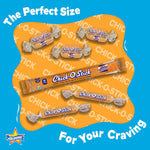 Close up of the toasted coconut and roasted peanut layers inside a broken Chick O Stick bar