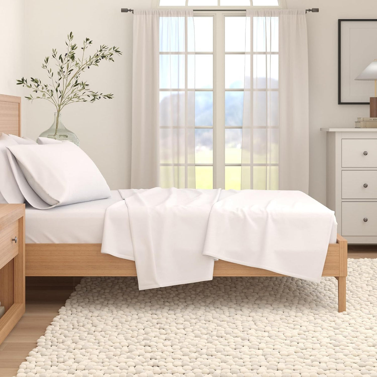 Full three piece twin bedding set laid out on mattress