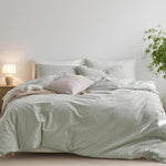 Nayoroom green striped duvet cover king size set laid out flat on a bed front view