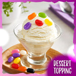Colorful bulk confectionery treats used as decorative toppings on frosted cupcakes.
